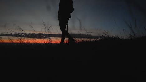 Hiker-walking-in-slow-motion-during-sunrise