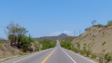Another-shot-of-one-of-the-main-roads-in-the-south-of-the-dominican-republic,-entering-a-city-called-azua
