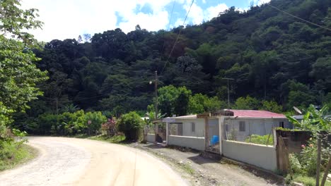Driving-into-the-farm-roads-of-the-dominican-republic,-in-a-community-called-san-jose-de-Ocoa