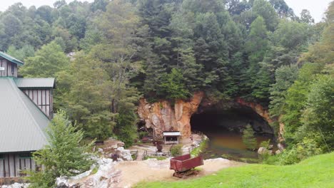 4K-Drone-Video-of-Mining-Cave-at-Emerald-Village-near-Little-Switzerland,-NC-on-Summer-Day
