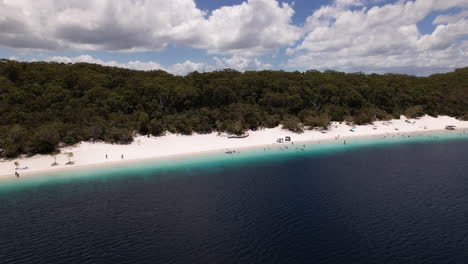 Pan-drone-shot-of-Lake-Mckenzie,-Australia,-December,-Summer