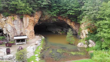 4K-Drone-Video-of-Mine-Cave-at-Emerald-Village-near-Little-Switzerland,-NC-on-Summer-Day