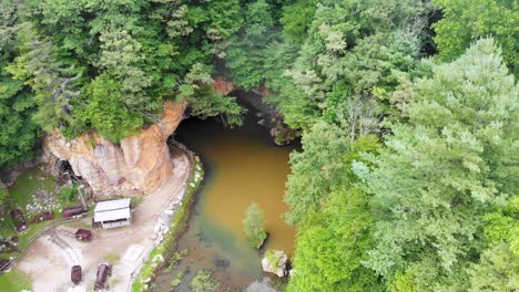 4K-Drone-Video-of-Mining-Train-and-Cave-at-Emerald-Village-near-Little-Switzerland,-NC-on-Summer-Day