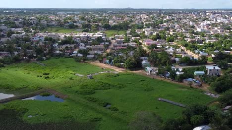 A-drone-shot-of-la-altagracia-province,-at-the-east-side-of-the-dominican-republic,-you-can-see-a-baseball-field