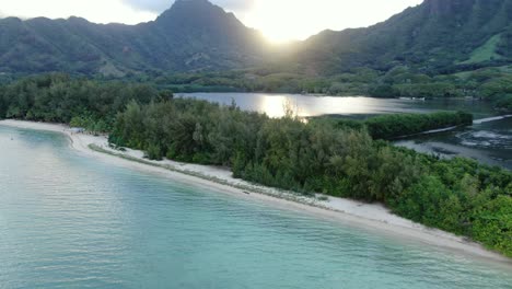 Smooth-cinematic-aerial-flyover-of-Kaneʻohe-Bay-approaching-the-Moli'i-Fish-pond-at-sunset