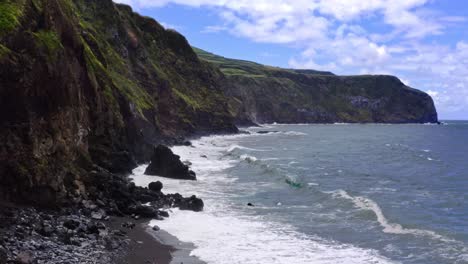 Waves-crashing-on-rugged-atlantic-cliff-coastline-of-Azores,-aerial