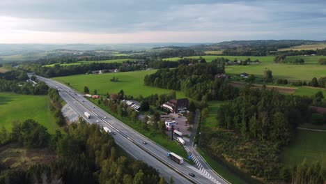 Aerial-drone-view-of-popular-highway-or-expressway-D1-in-Czech-Republic,-sunset-saturated-colors,-zoom-in