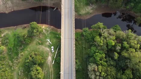 Aerial-following-a-road-that-goes-over-the-Paraguay-river