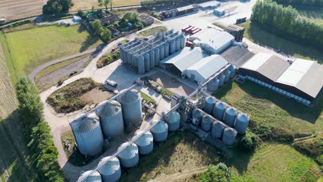 Slow-rotating-aerial-drone-shot-of-an-animal-feed-processing-plant