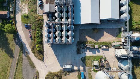 Bird-eyes-view-aerial-footage-of-an-small-industrial-plant-with-large-silos