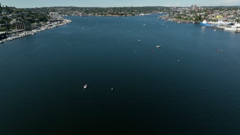 Aerial-shot-tilting-up-from-Lake-Union-to-reveal-numerous-boats-out-playing-on-the-water