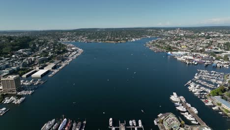 Wide-drone-shot-of-Lake-Union-in-Seattle-on-a-warm-summer-day-filled-with-boats