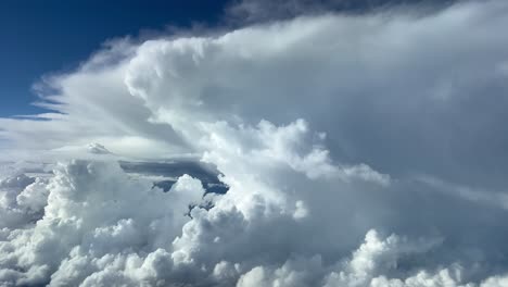 Stunning-view-of-the-upper-part-of-a-huge-cumulonimbus-from-the-cockpit-of-a-jet-flying-at-12000-metres-high