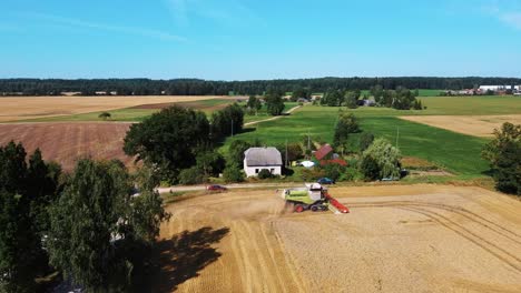 Aerial-View-of-Harvester-Machines-Working-in-Wheat-Field-1