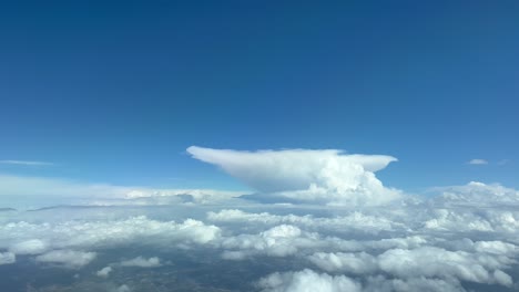 Unique-view-of-the-top-view-of-a-huge-cumulonimbus,-anvil-shape,-from-a-jet-cockpit-flying-at-12000-metres-high