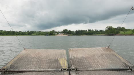 Travelling-Barge-Approaches-an-Island-on-Calm-River-Afram-Cloudy-Day