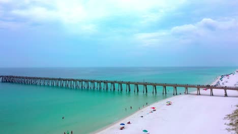 Beautiful-aerial-view-flying-towards-the-pier-on-Navarre-Beach-Florida