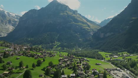 Aerial-view-of-Grindelwald-and-a-paraglider-in-Switzerland