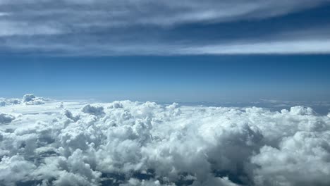 Nice-aerial-view-from-a-jet-cockpit-while-overflying-a-messy-sky-plenty-of-tiny-cumulus