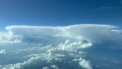 Impressive-aerial-view-from-a-cockpit-jet-at-cruise-level-of-a-threatening-line-of-cumulonimbus-ahead
