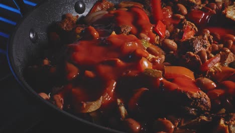 Tomato-Sauce-Pouring-Into-Spicy-Chicken-Bean-Cooking-In-Pan