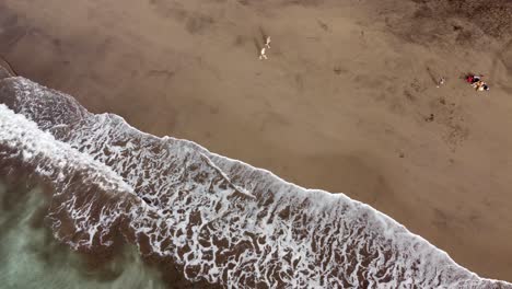 Aerial-view-of-Gui-Gui-Beach,-las-Palmas-de-Gran-Canaria-during-Calima-,-4k-drone-footage-5