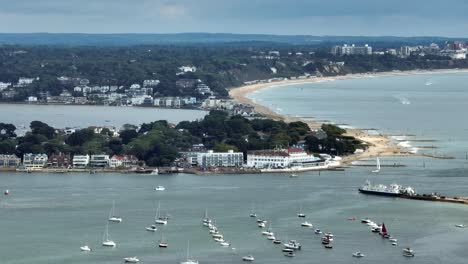 Aerial-view-of-Sandbanks-and-Ferry-at-the-entrance-to-Poole-harbour,-Dorset,-UK