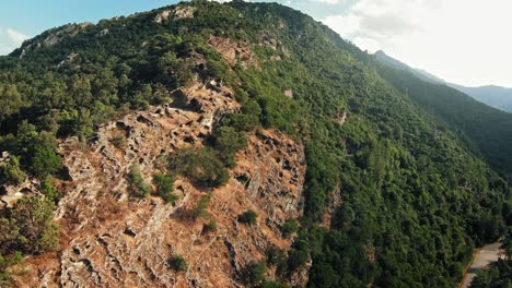Fast-drone-flyby-of-a-cliff-side-in-the-mountains-of-Corsica