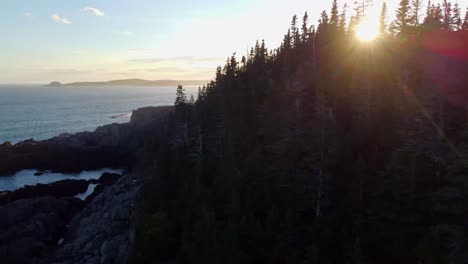 A-panning-drone-shot-of-the-start-to-a-sunset-on-the-coast-of-Northern-Maine