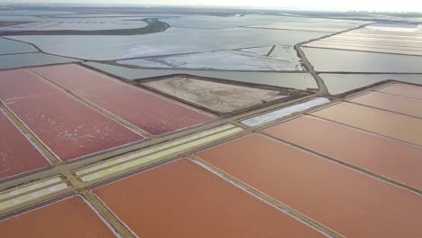Aerial-panoramic-view-of-red-salines-in-the-coast-of-Cadiz