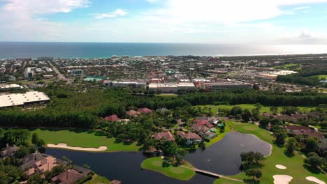 Drone-view-flying-away-from-Regatta-Bay-golf-and-yacht-club-in-Destin-Florida