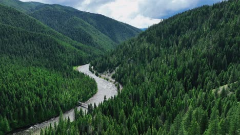 Aerial-Panoramic-View-Lush-Mountains-And-Flowing-River-In-Lolo-National-Park-In-Missoula-County,-Montana,-United-States