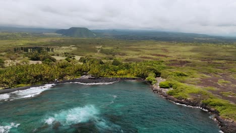 Aerial-View-Of-Punaluʻu-Beach-On-A-Cloudy-Day,-Big-Island,-Hawaii---drone-shot