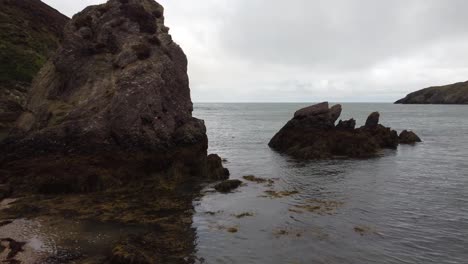 Close-Shot-Near-Natural-Big-Rock-Formation,-Porth-Wen-Beach,-United-Kingdom