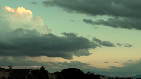 Twilight-cloudscape-above-a-suburban-neighborhood---time-lapse