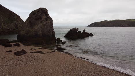 Panoramic-View-Of-Beach-Landscape,-Soft-Waves,-Porth-Wen,-United-Kingdom