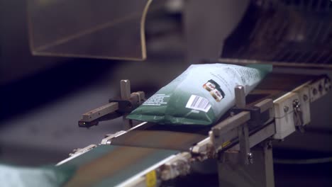 Freshly-packaged-coffee-beans-on-the-factory-conveyer-belt-1
