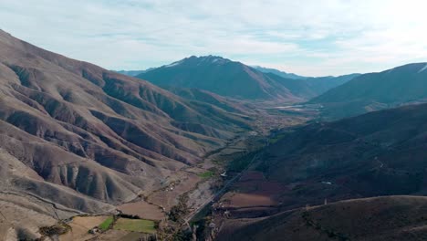 Aerial-view-of-the-Limari-Valley,-rugged-mountains,-near-the-foothills,-northern-Chile