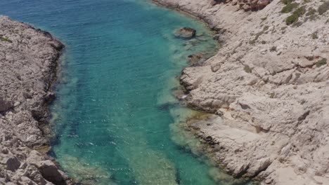 Aerial---Crystal-clear-water-in-Korakonisi,-Zakynthos,-Greece