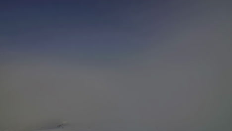 Time-lapse-of-cloud-inversion-over-white-snow-capped-mountains