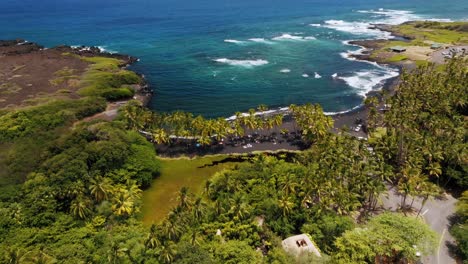 Punaluʻu-Beach-With-Black-Sand-And-Turquoise-Water-In-Big-Island-Of-Hawaii---aerial-drone-shot