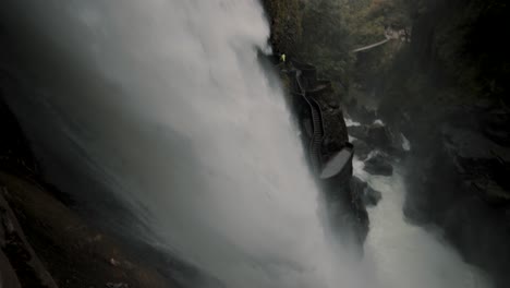 Powerful-Flow-Of-Water-Of-Pailon-Del-Diablo-Waterfall-In-Baños-De-Agua-Santa,-Ecuador---Tilt-Down