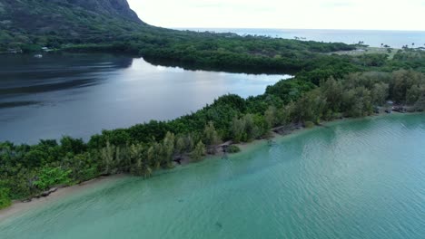 Flying-above-the-natural-wall-between-the-ocean-and-traditional-Hawiian-fishpond
