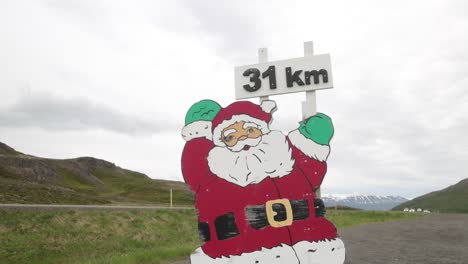 Santa-Claus-cutout-in-the-mountains-of-Iceland-with-gimbal-video-walking-forward