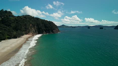Drone-cinematic-aerial-reveal-of-Cathedral-Cove,-New-Zealand
