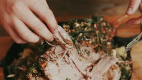 Checking-tenderness-of-boiled-lamb-meat-during-serving