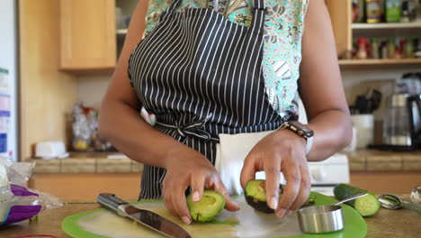 Peeling-a-sliced-avocado-to-add-to-a-chopped-salad---ANTIPASTO-SALAD-SERIES