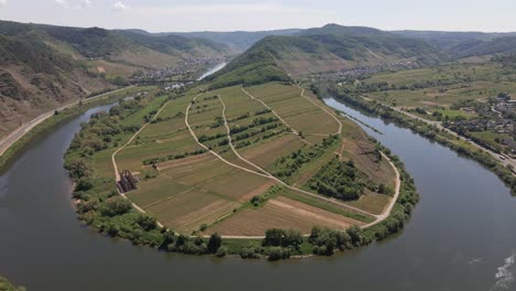 Rotating-Aerial-Shot-Of-The-Bremm-Moselle-Loop-With-Vineyards-In-The-Middle