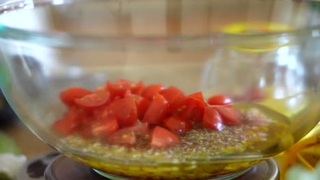 Adding-fresh,-chopped-tomatoes-to-the-homemade-olive-oil,-vinegar,-and-shallot-salad-dressing---ANTIPASTO-SERIES
