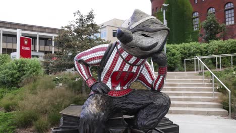 Bucky-Badger-statue-on-the-campus-of-the-University-of-Wisconsin-in-Madison,-Wisconsin-with-gimbal-video-circling-around
